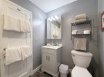 Full bathroom has a shower tub combo